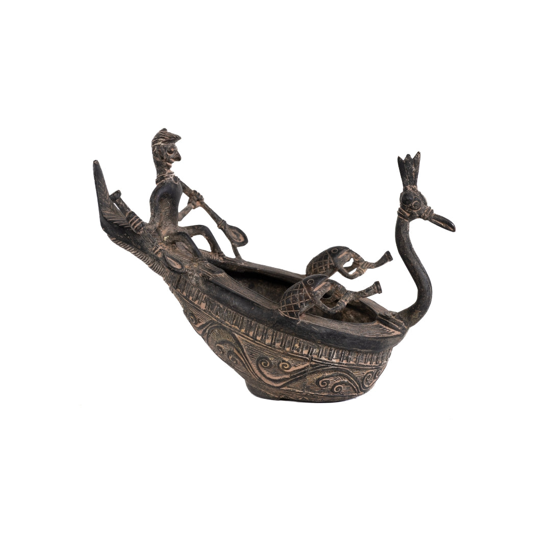ESCULTURA CANOA PAVORREAL DE BRONCE